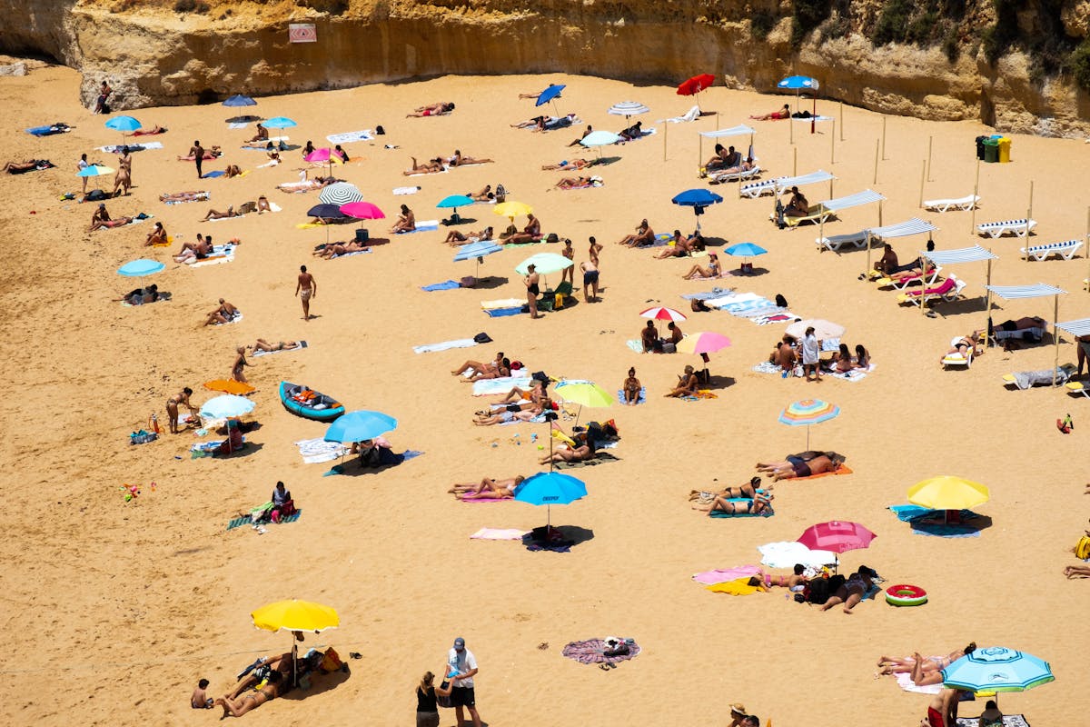 Aerial view of crowded summer beach — Cap d'Agde naturist beach guide