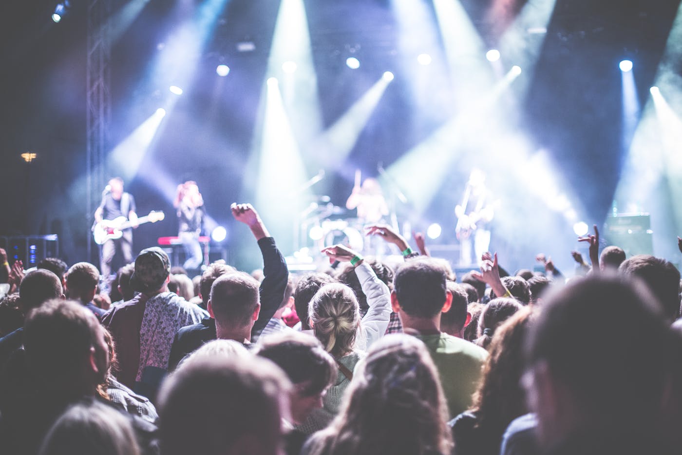 Outdoor concert crowd enjoying live music at night – European music festival season 2026