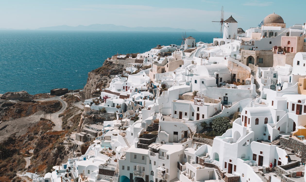 Santorini Greece white buildings blue sea – best shoulder season destination in Crete Greece