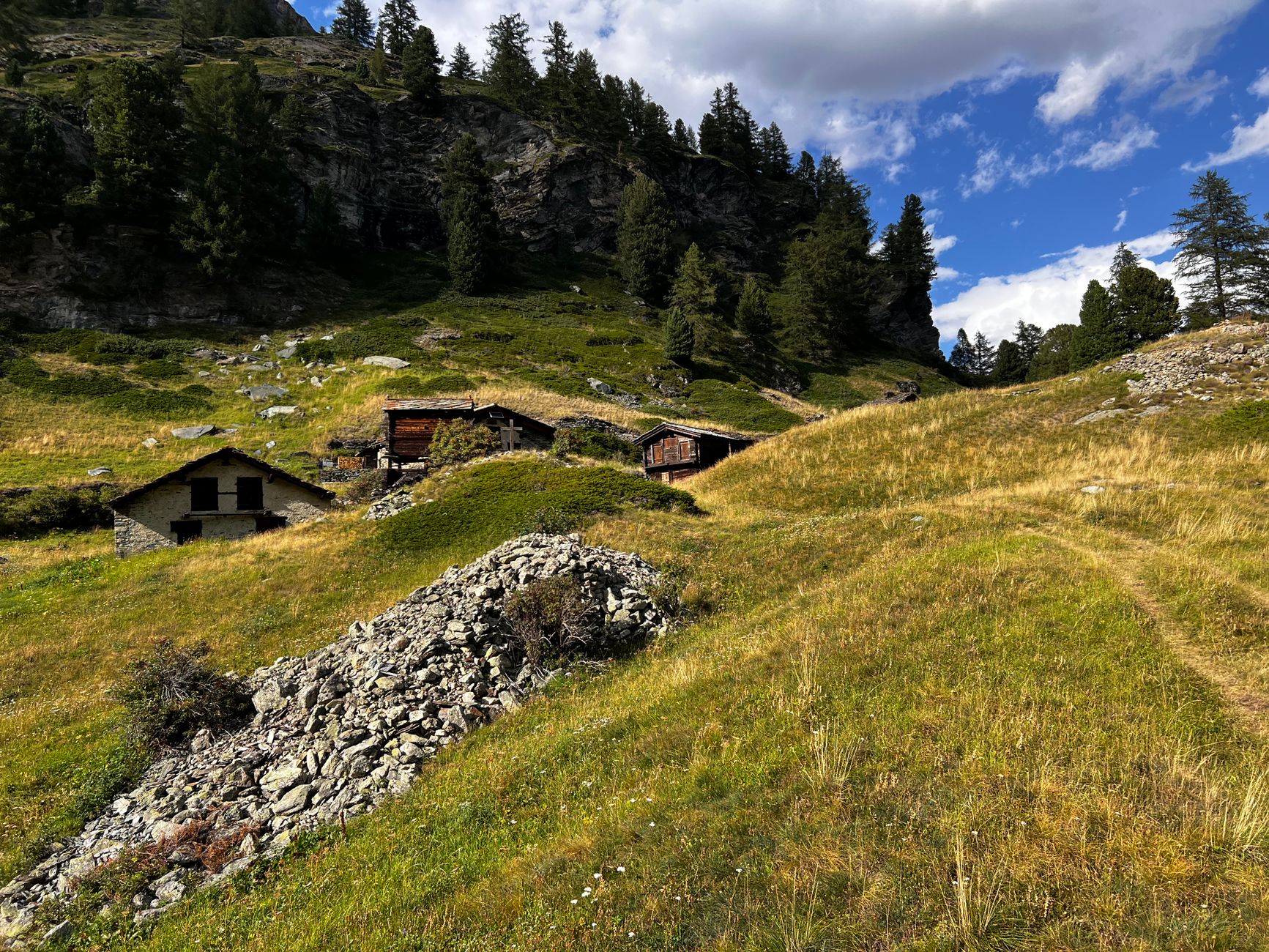 Alpine cabins in Zermatt Switzerland under blue sky โ planning your Switzerland trip