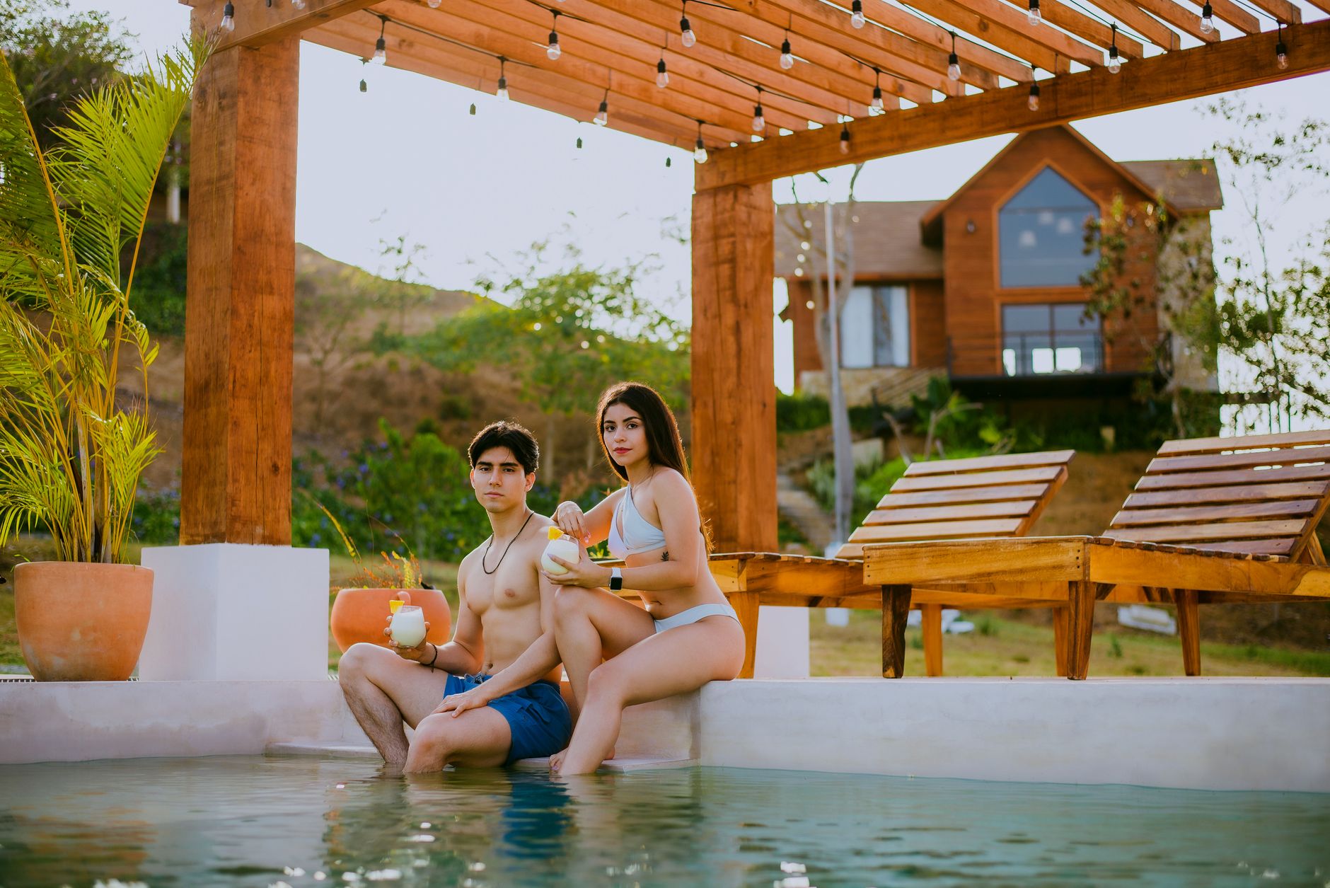 What adults-only means in Mexico: grown-ups relaxing at a calm tropical resort pool or swim-up bar with cocktails, no ch