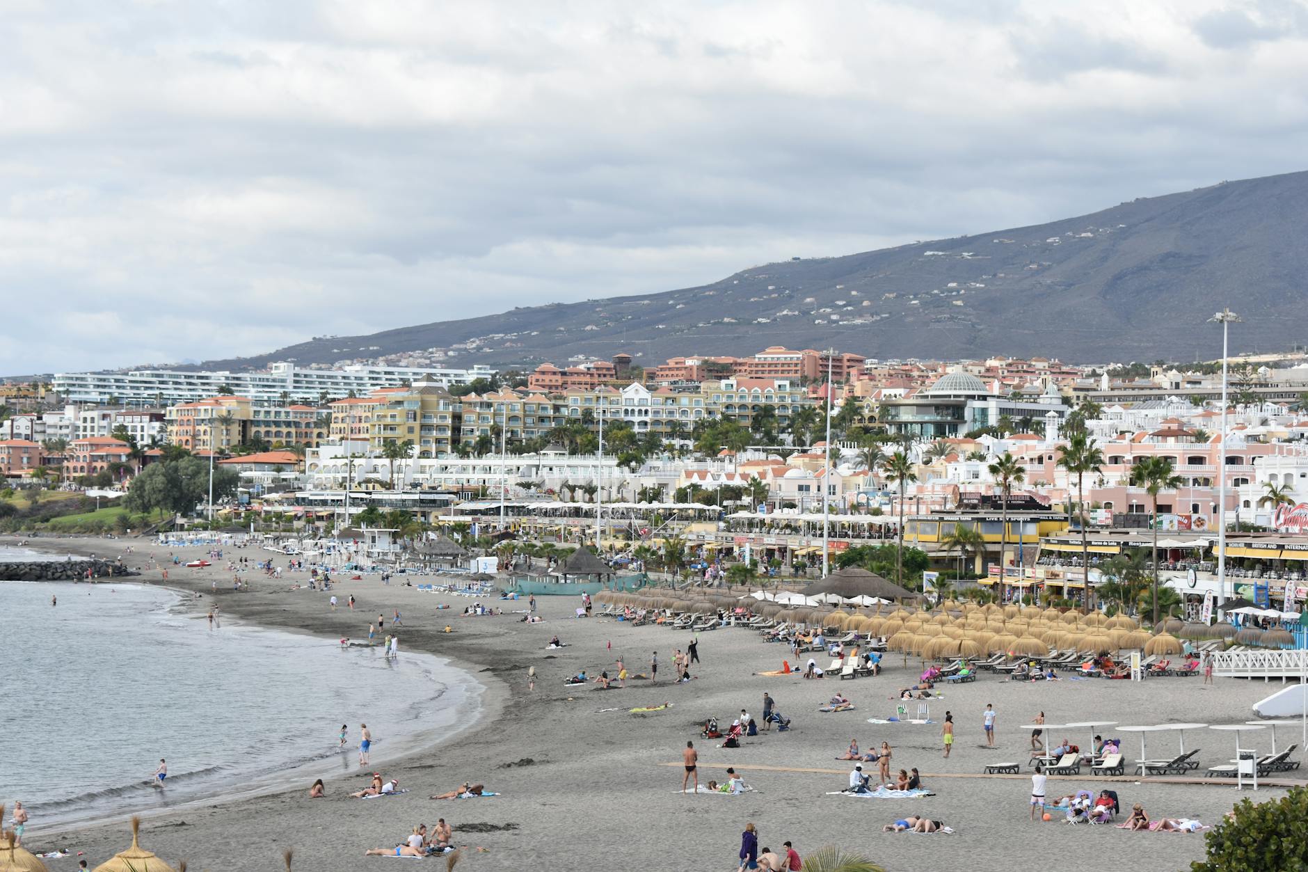 Tenerife Playa de las Americas outdoor beachfront bar terrace night crowd