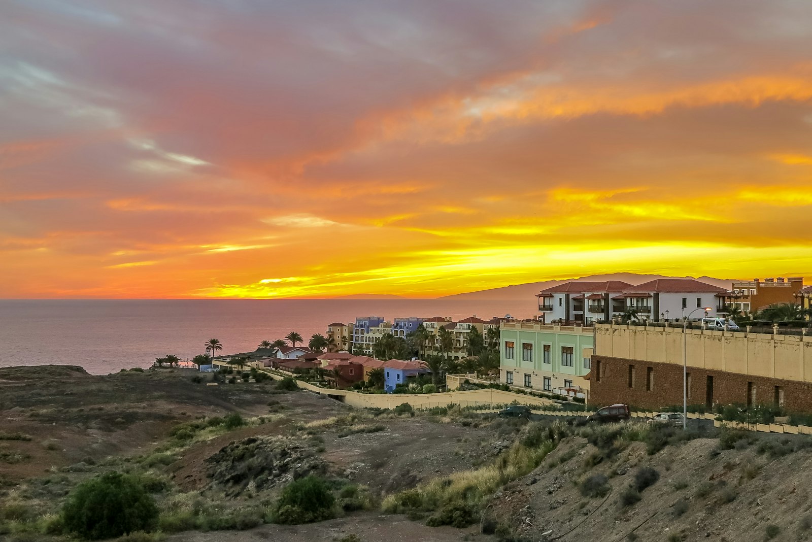 Fiery sunset over the Costa Adeje resort hillside β southern Tenerife's after-dark party scene