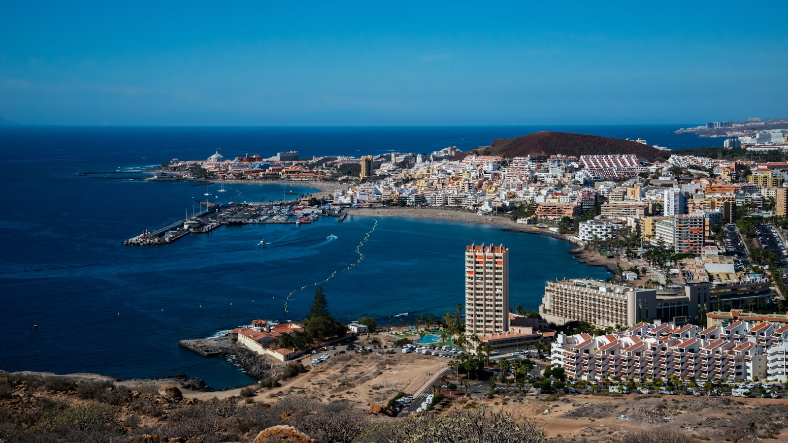 Aerial view of Los Cristianos harbour and resort town β the southern Tenerife party scene near Playa de las Americas