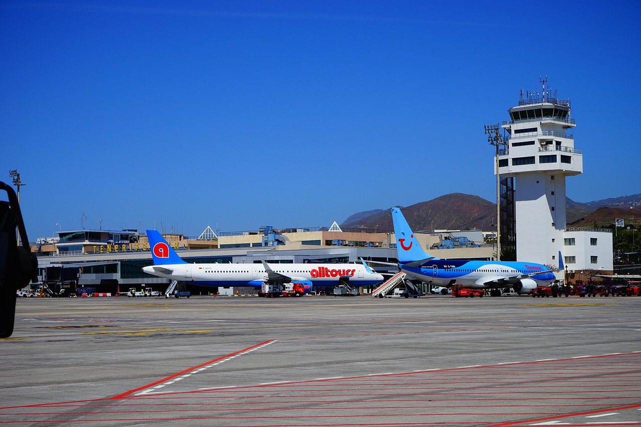 Tenerife South TFS airport terminal building and control tower with planes β getting to Tenerife flights guide for first-timers
