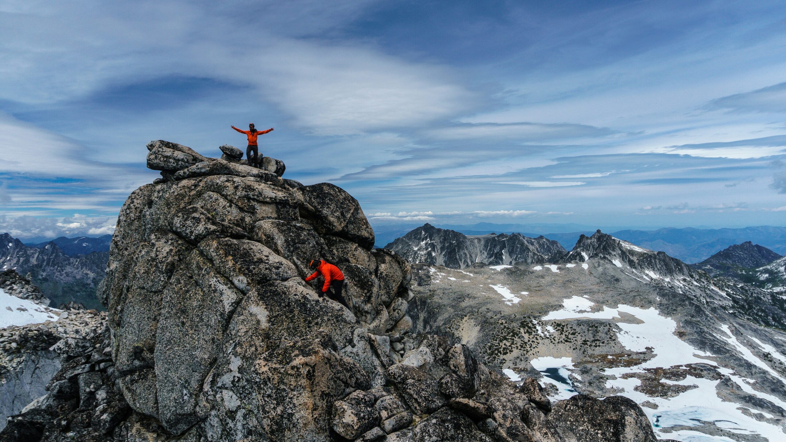 Triumphant Dolomites summit moment โ the rewarding view after a via ferrata climb