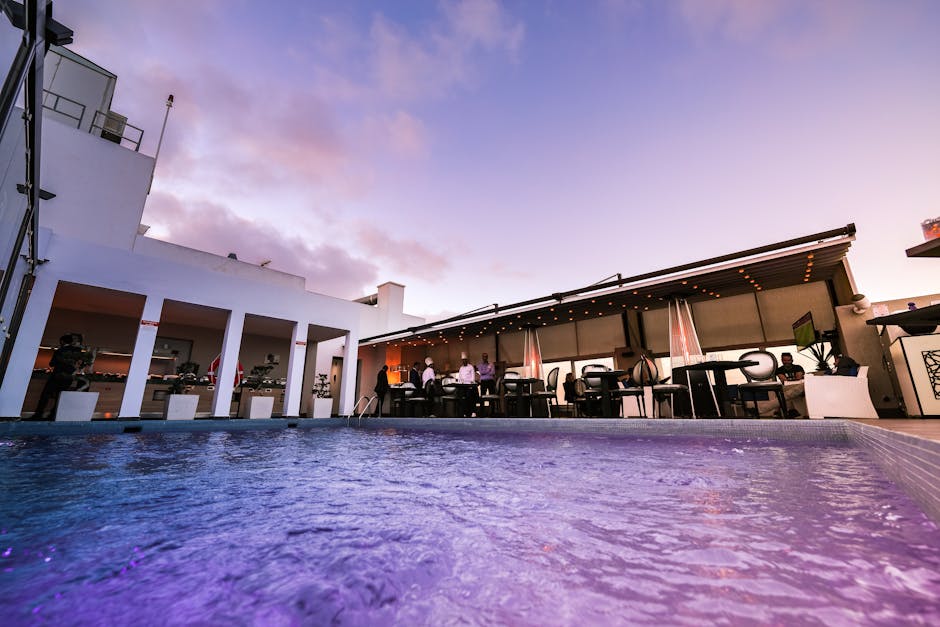 Rooftop hotel pool at sunset — lifestyle hotel takeover vibe