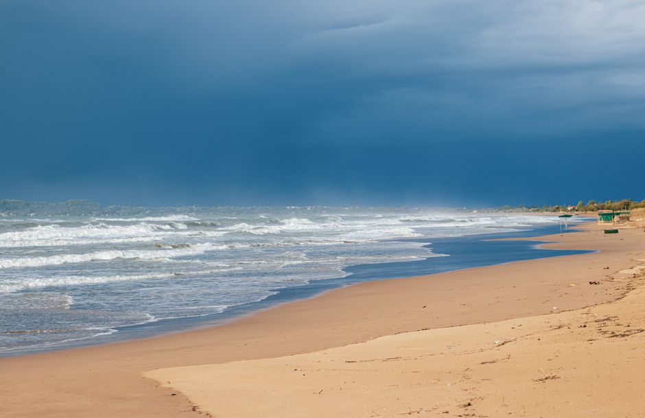 Long sandy Mediterranean beach along the coast