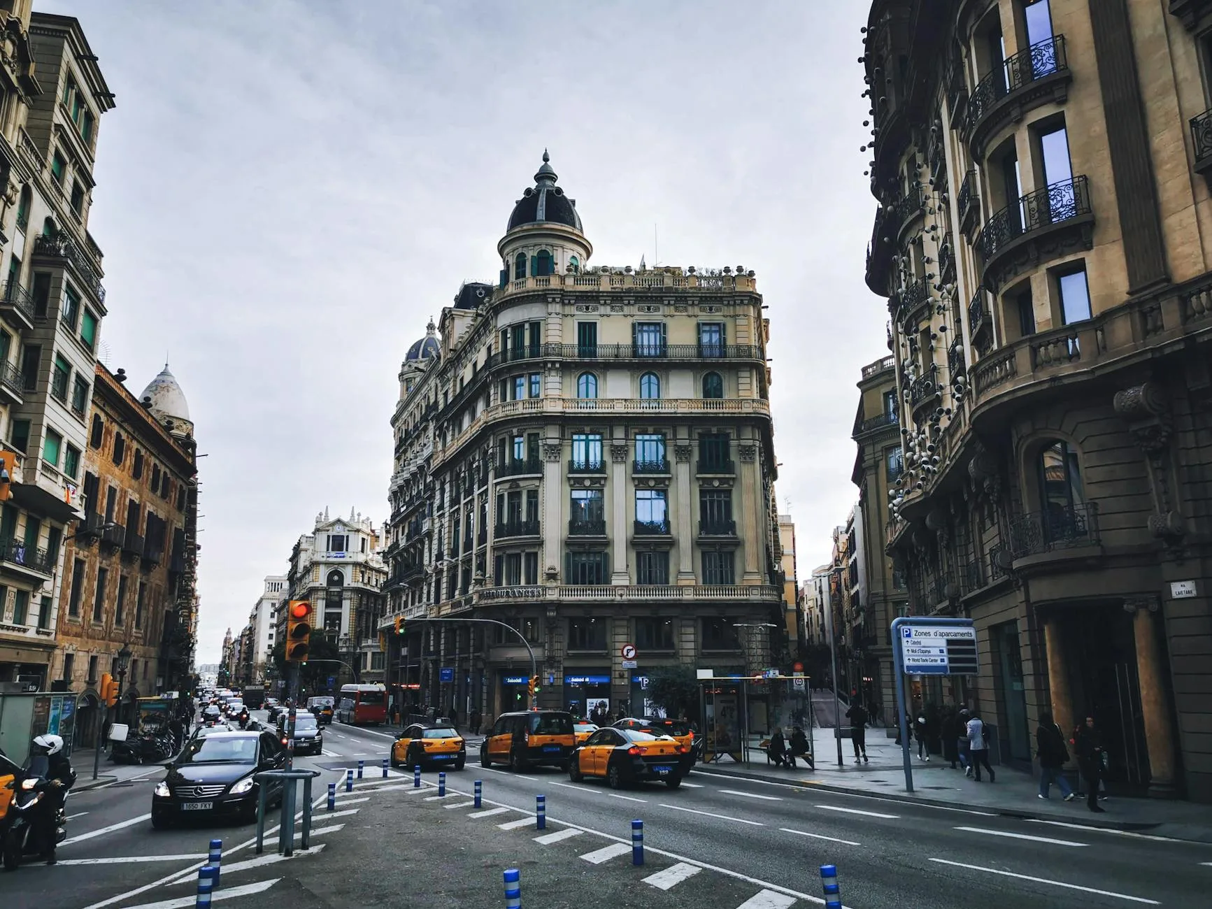 Barcelona street at night with taxis β late-night transport between lifestyle venues
