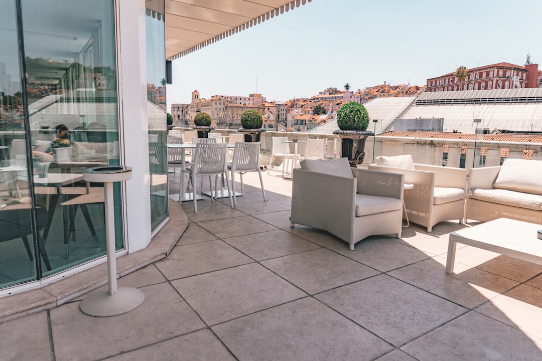 white armchairs in front of store – What to Look For in a Cheap Lisbon Hostel