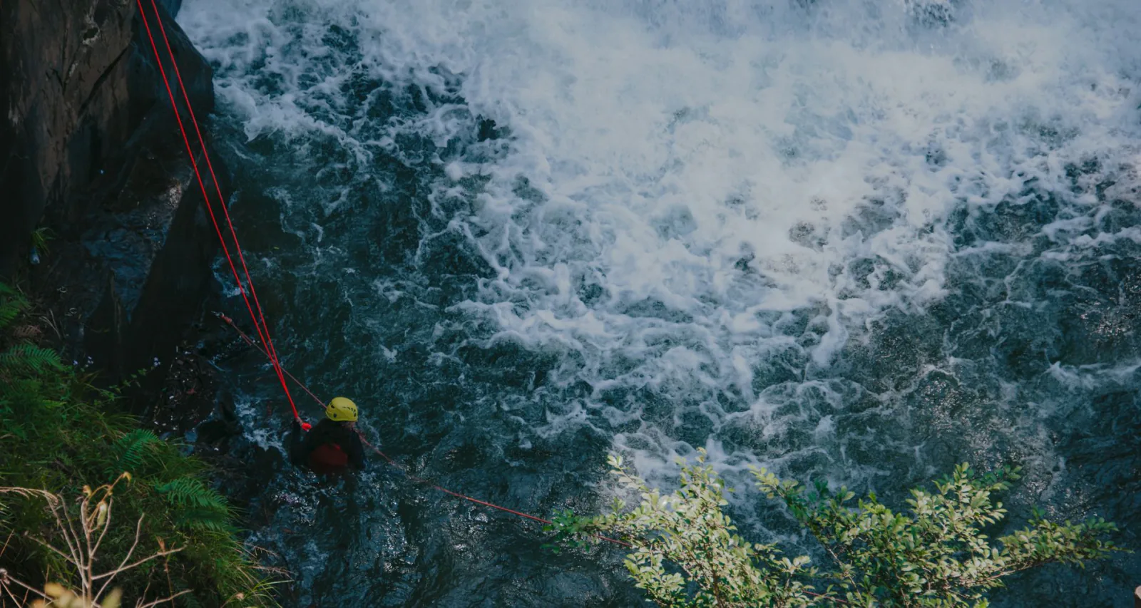 What a first canyoning descent feels like: abseiling down a waterfall, jumping into pools and sliding natural rock chute
