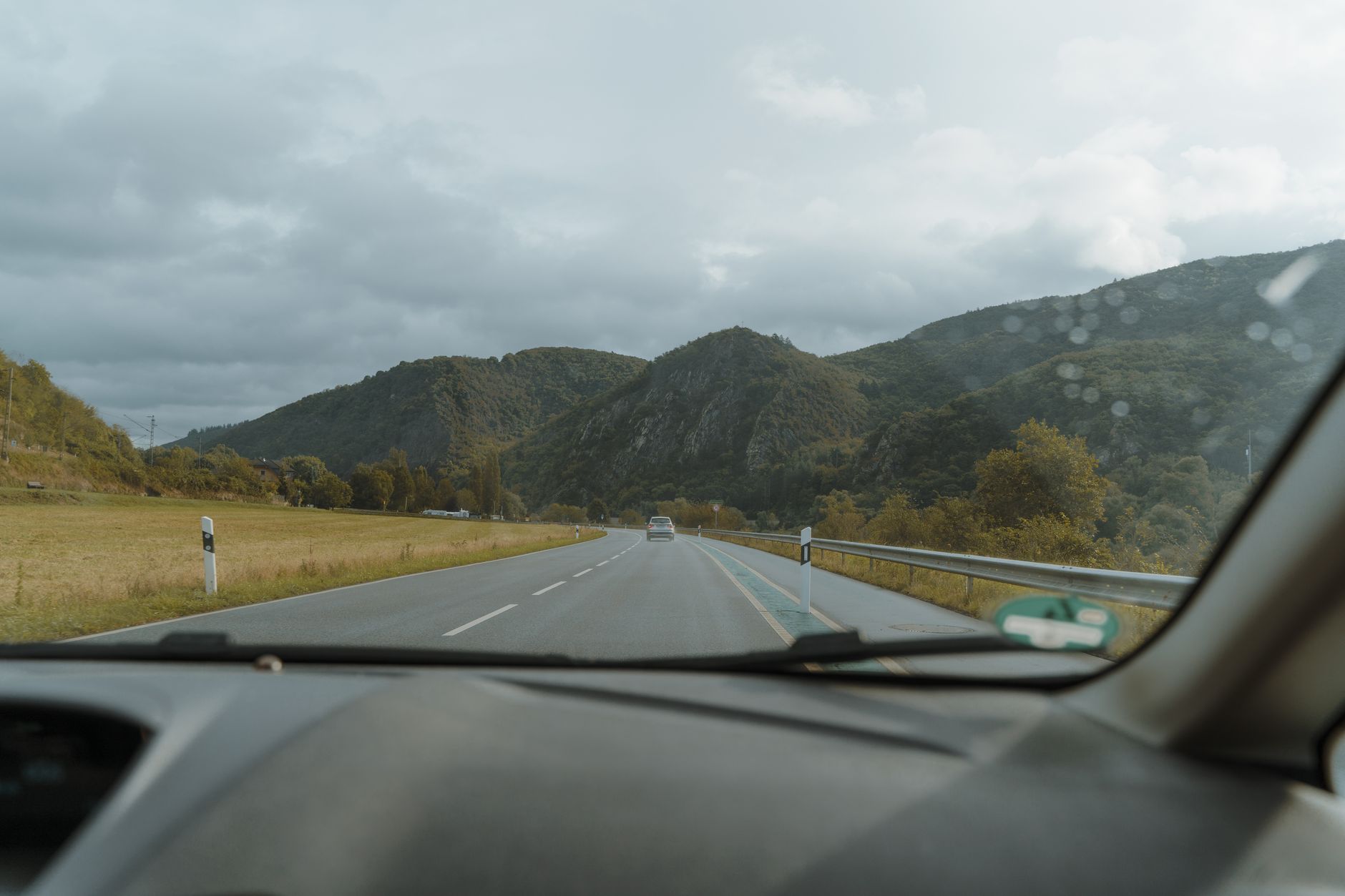 Planning and gear: caving helmet, headlamp, harness and overalls laid out or worn, or the drive from Ljubljana through S