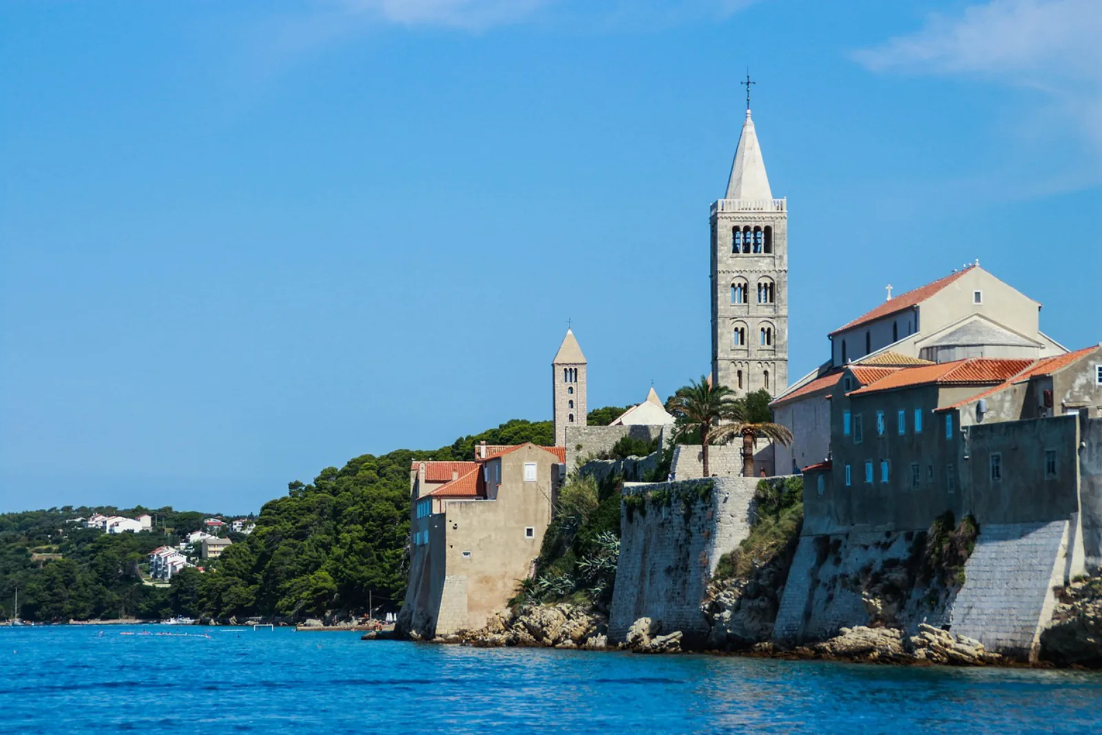 Rab island old town skyline with its four historic bell towers, Croatia – Kandarola “English Beach” (Rab) section