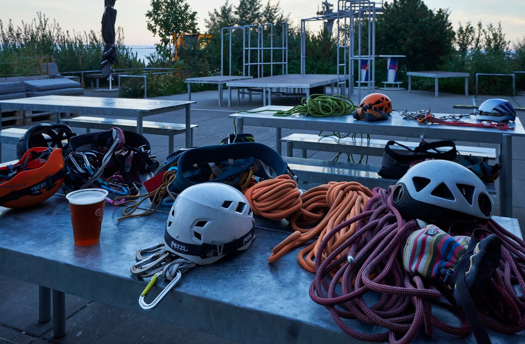 a table with a helmet and a drink on it – What It Costs: Accommodation, Gear Rental and Guided Courses in 2026