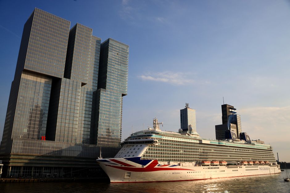De Rotterdam towers and a cruise ship docked in Rotterdam, Netherlands. – The P&O Catch: Why Arcadia and Aurora Won't Stay Kid-Free