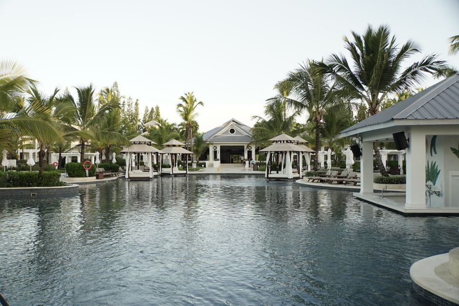 Beautiful tropical resort pool with cabanas and palm trees, perfect for a relaxing getaway. – 5. TRS Turquesa Hotel — Best Quiet Luxury