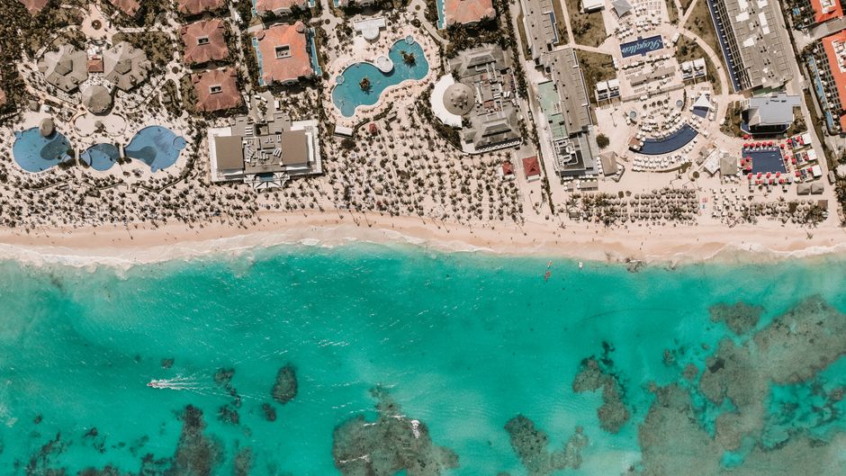 Stunning aerial view of a resort by turquoise waters and sandy beach. – 1. Hyatt Zilara Cap Cana — Best Overall Luxury