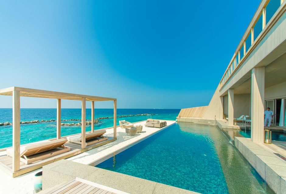 Stunning view of a luxury resort in Maldives with an infinity pool overlooking the ocean. – 2. W Punta Cana — Best New Opening