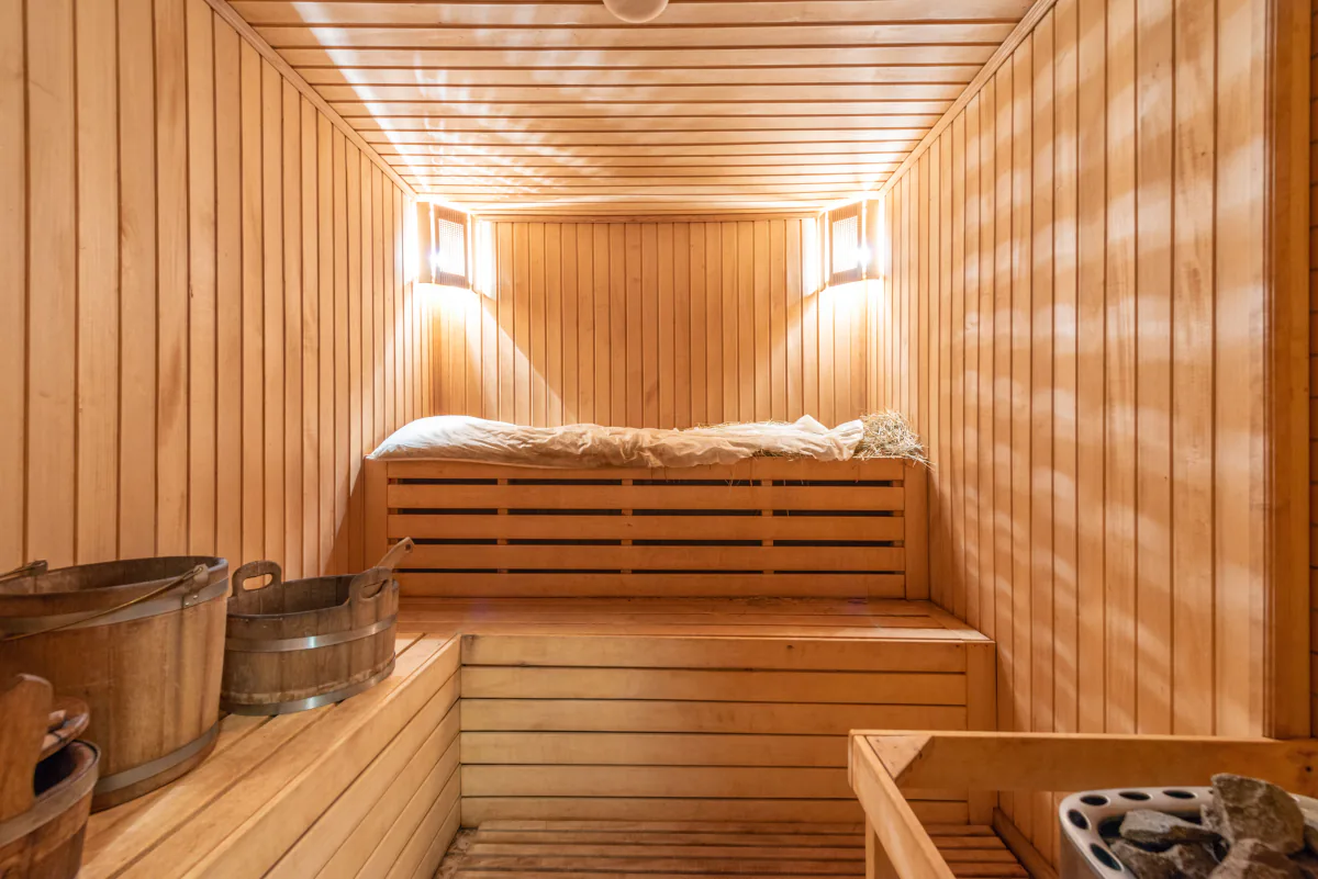 Warm wooden sauna interior with ambient lighting – what an FKK club looks like inside, Germany