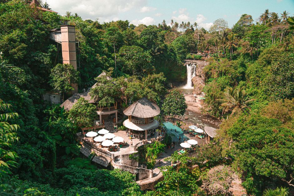 A serene tropical resort nestled in a lush forest in Ubud, Bali, featuring a stunning waterfall. – Ubud: Jungle Escapes for Slow, Quiet Couples