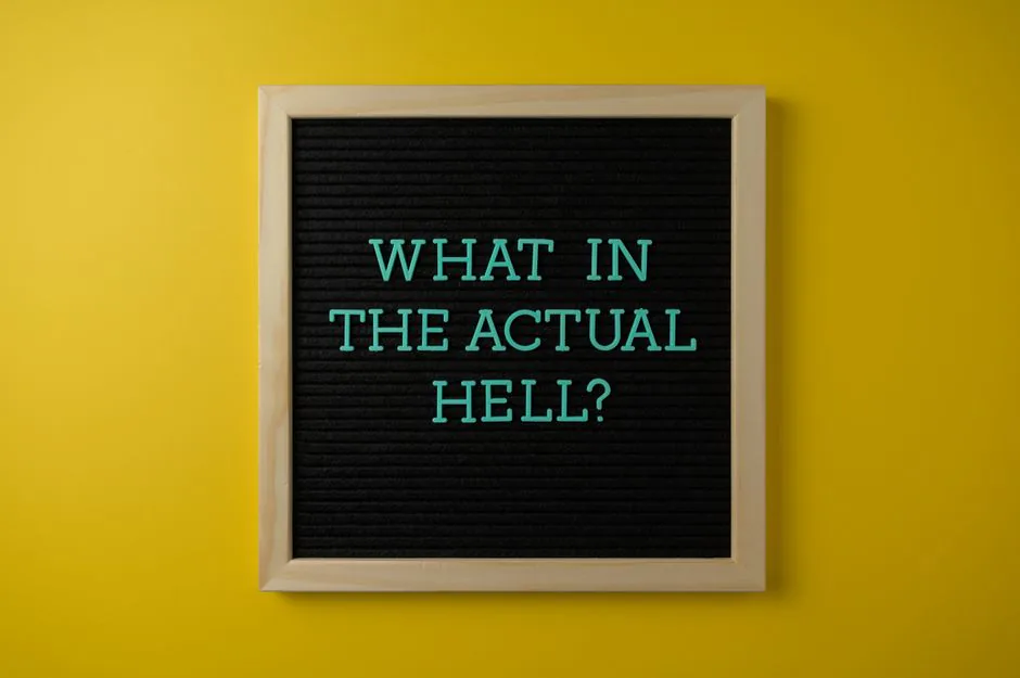 Letter board with humorous quote 'What in the actual hell?' on a vibrant yellow backdrop. – Inside NIBIRU — What Beach, Please! Actually Looks Like On-Site