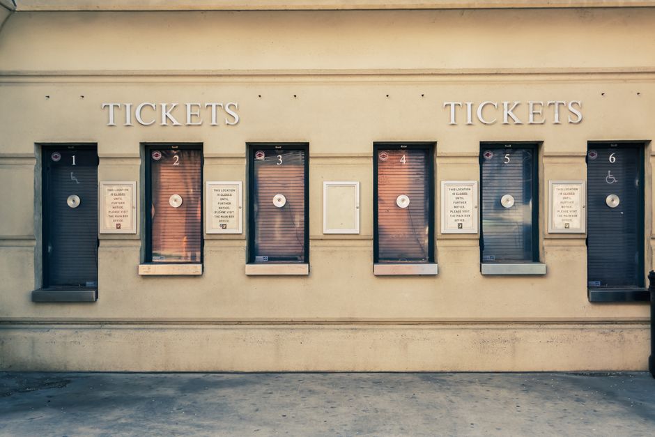 Row of closed ticket booths in Baltimore city center, showcasing urban architecture. – Tickets and Prices: General Admission vs VIP