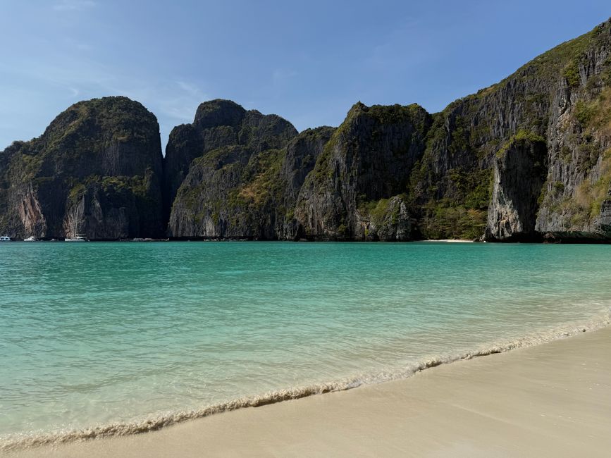 Stunning view of Maya Bay with turquoise waters and limestone cliffs in Thailand. – 4. Zeavola Resort — Best for Romance & Nature