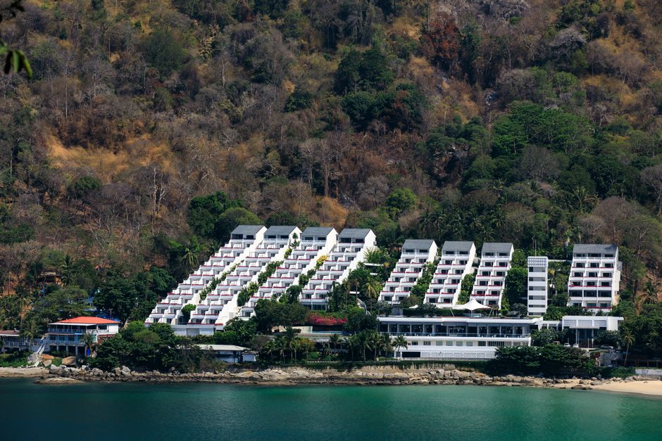 A scenic view of a modern resort nestled on the lush coastline of Phuket, Thailand. – 5. Aleenta Phuket Resort & Spa — Best for Quiet Luxury