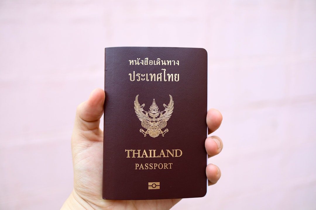 a person holding a thai passport in their hand – Quick Planning Notes Before You Book