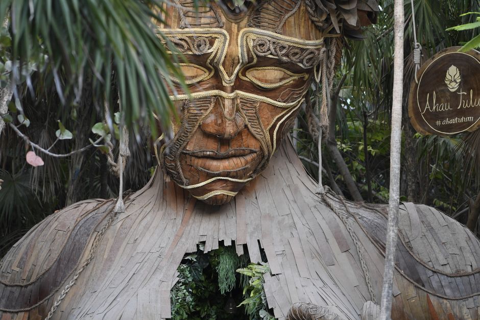 Discover the majestic Ven a La Luz wooden sculpture in Tulum's lush jungle setting. – When Is Zamna Tulum 2027? Dates and the Multipass Explained