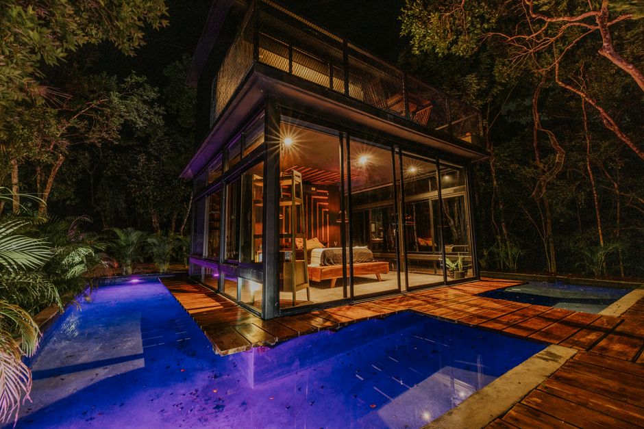 Experience a night in a luxury secluded glass house with a glowing pool surrounded by jungle. – Getting There: Flights, Transfers and Where to Stay