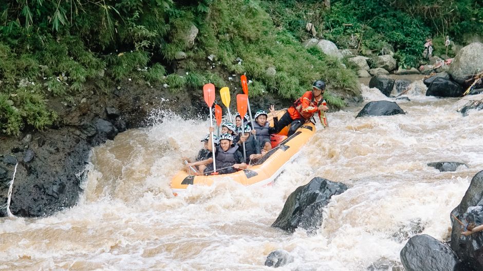 Group of adults white water rafting on a turbulent river, showcasing adventure and excitement. – Safety: The Honest Facts