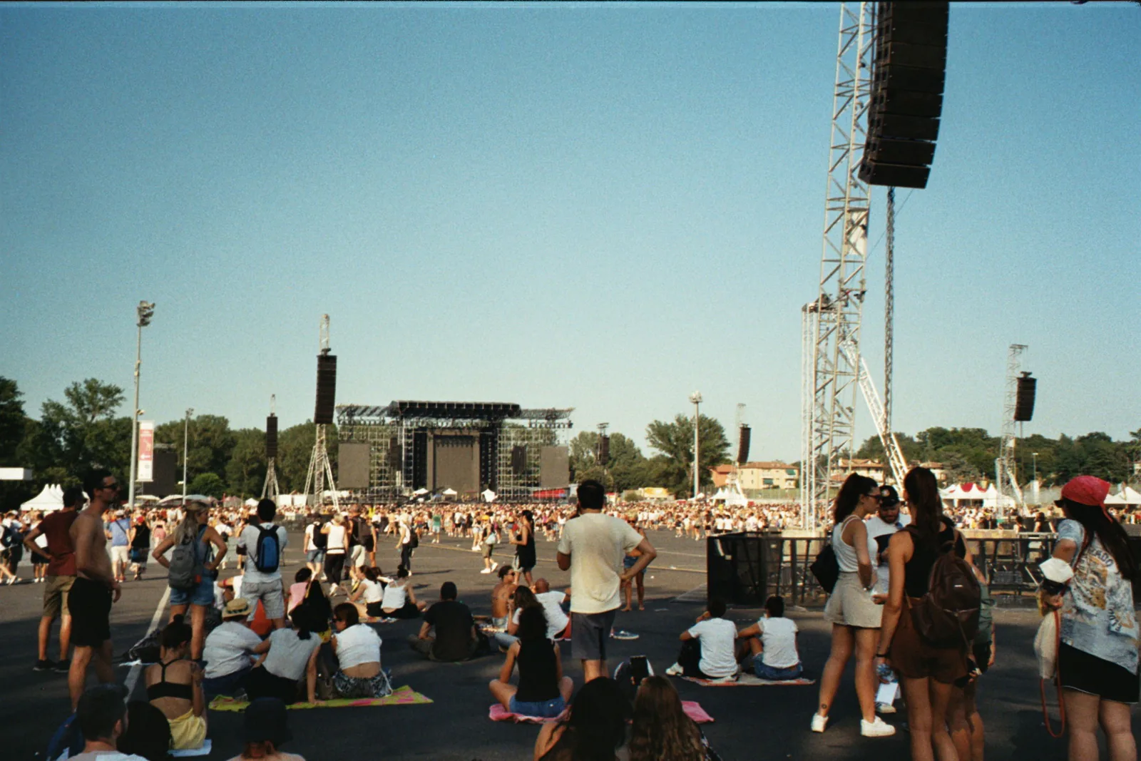 Crowd enjoying a summer outdoor music festival on a sunny day. – What Is Boom Festival, and Why Does It Matter?