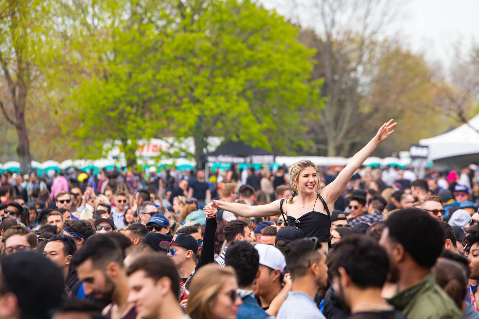 Lively outdoor festival crowd enjoying a sunny afternoon. – Boom Festival Tickets: Price Tiers and What They Include