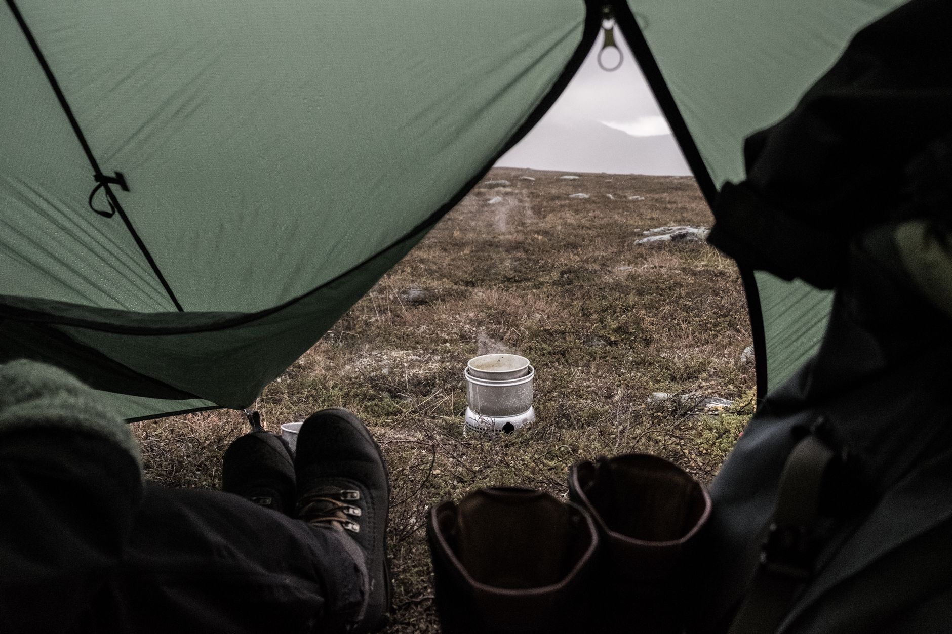 View from tent of outdoor cooking in Jämtlands, Sweden, perfect for hiking and camping enthusiasts - Leave No Trace camping etiquette, wild camping in