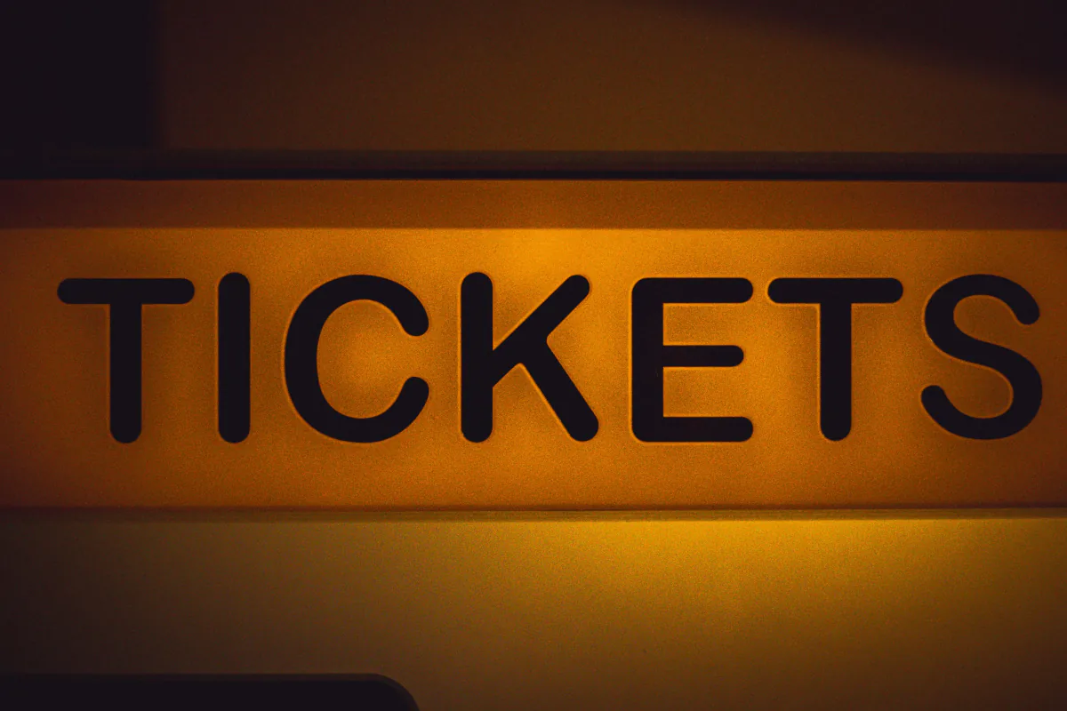 Illuminated TICKETS sign at a festival entrance – choosing between ADE Pro Pass and single event tickets