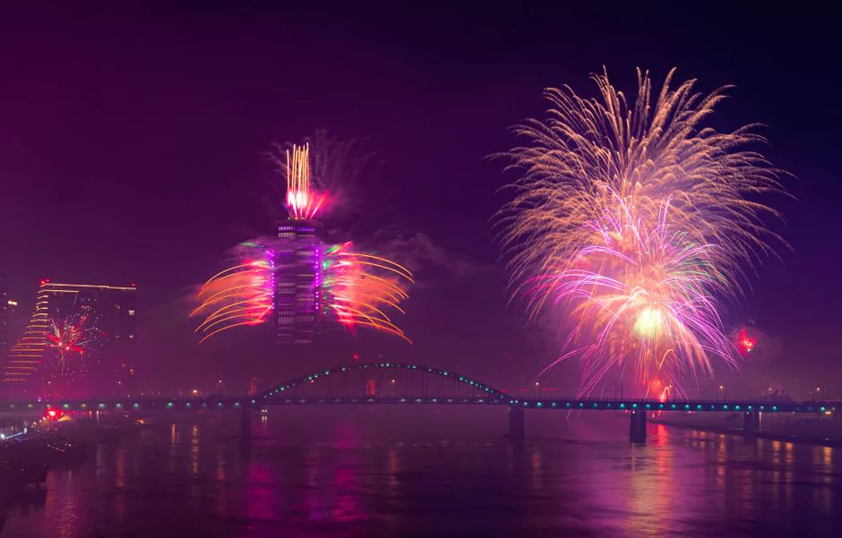 Fireworks over Belgrade Waterfront tower and the Sava bridge – why Belgrade New Year's Eve draws party travellers, Serbia