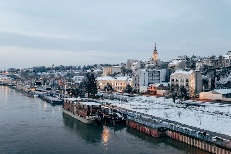 Moored splavs on a snowy Sava riverbank in winter – which Belgrade river clubs open for New Year's Eve