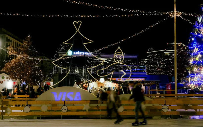 Skaters at a lit-up outdoor winter ice rink – free New Year's Eve street celebrations in Belgrade vs splav tickets