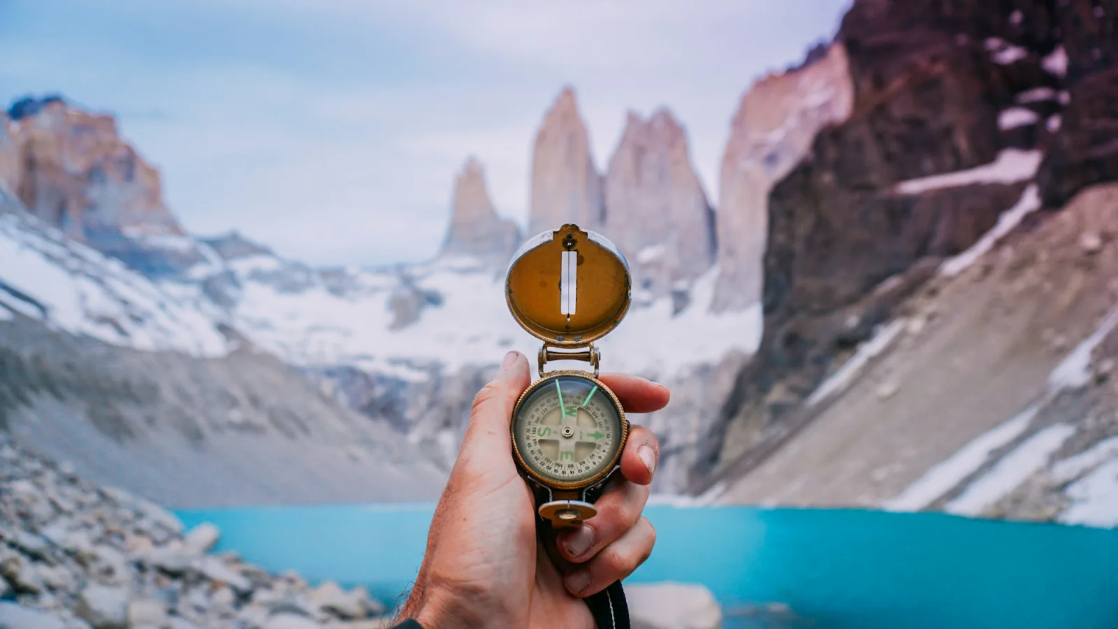 person holding compass – What Should You Check in a Policy Before Buying?