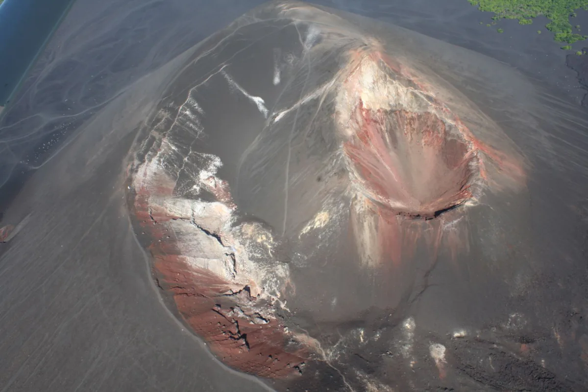 Aerial look into Cerro Negro's rust-streaked crater – what volcano boarding is, Leon, Nicaragua