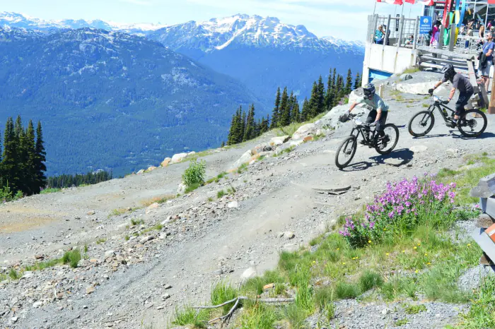 Riders leaving the Whistler Bike Park gondola download entrance – what makes Whistler different, Whistler BC