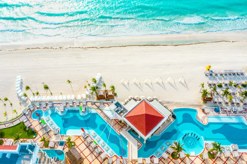 Aerial view of a resort pool and beachfront – what a lifestyle resort looks like, Cancún Hotel Zone