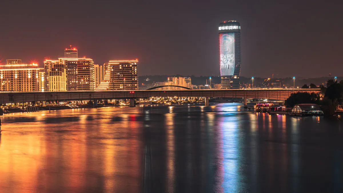 Belgrade's lit-up riverfront skyline mirrored in the water at night – What is Belgrade nightlife actually like in 2026?