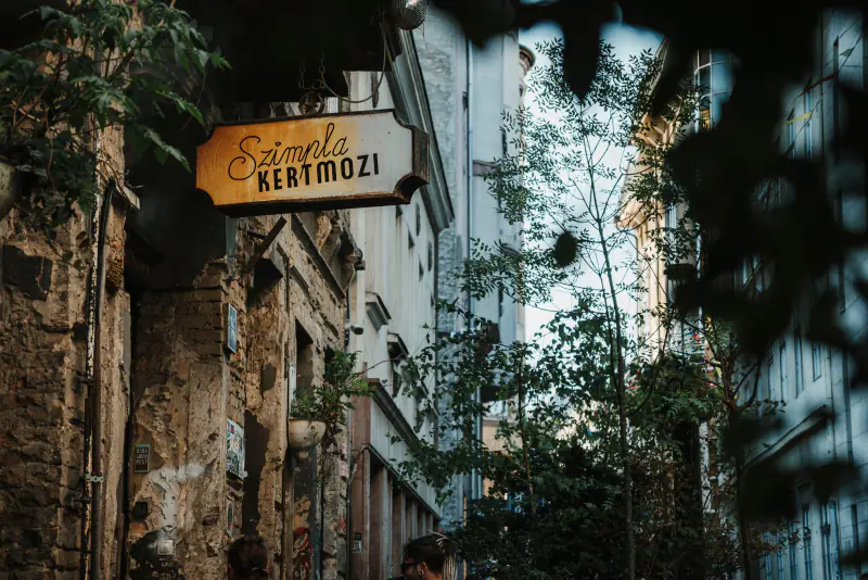 Szimpla Kertmozi neon sign in a Budapest ruin-bar alleyway – What is Budapest nightlife actually like in 2026?