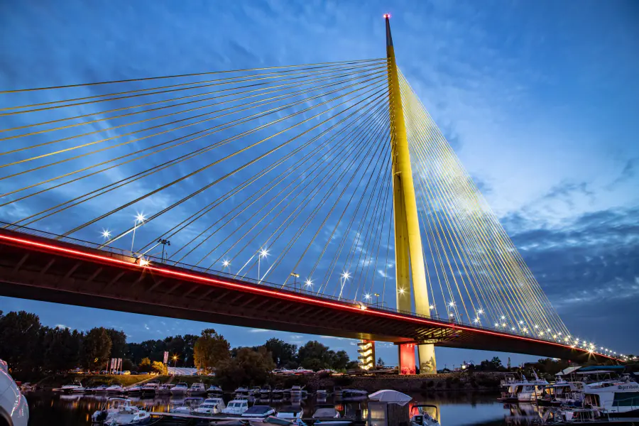 Belgrade's Ada Bridge glowing at blue hour above the Sava river boats – The verdict: book the one that matches your energy