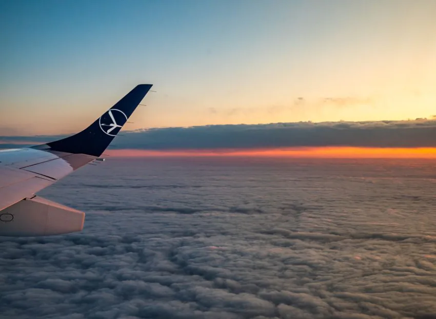 Sunset above the clouds from an aeroplane window – booking the flight to Europe's underrated techno clubs