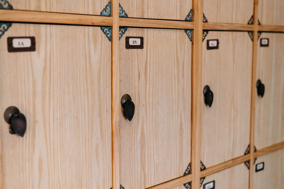 Numbered wooden changing-room lockers in a Japanese bathhouse – undressing and nudity rules section, Japan