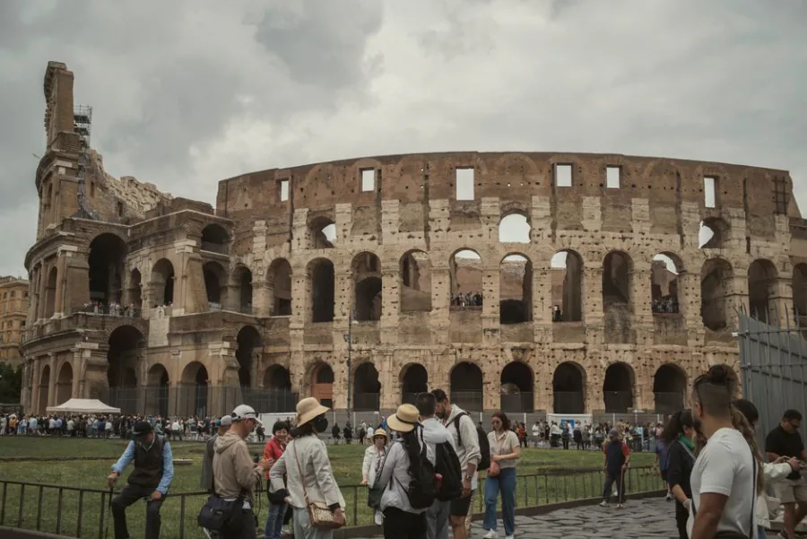Tourists gathered outside the Colosseum in Rome – Italy as an open-jaw itinerary city