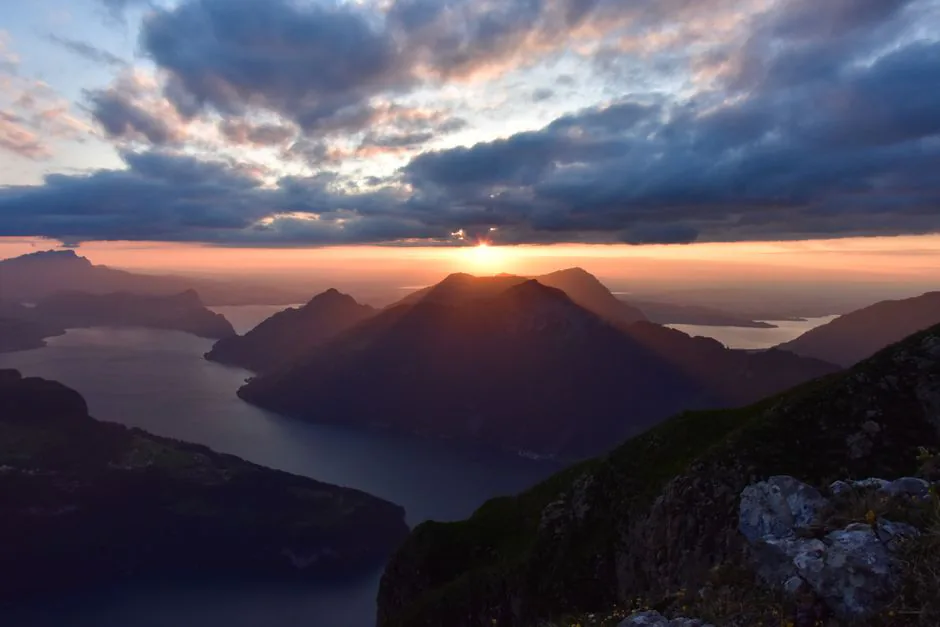 Sunset over Lake Lucerne and the Swiss mountains – final insurance checks before your adventure trip